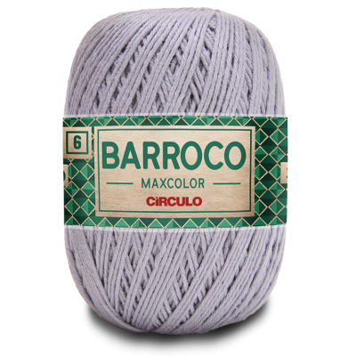 Novelo de fio de algodão lilás com etiqueta verde e dourada