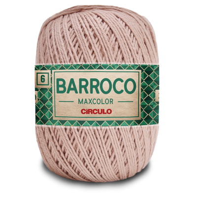Novelo de fio cor-de-rosa claro com etiqueta verde e bege