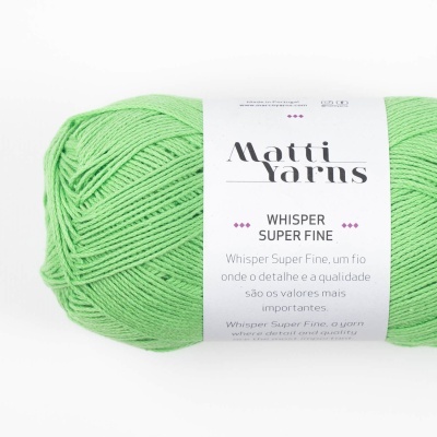 Novelo de lã verde claro com etiqueta branca