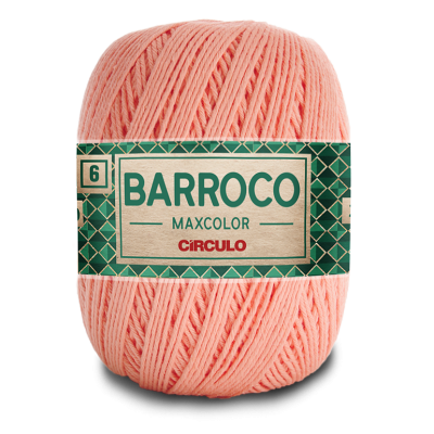 Novelo de linha cor-de-rosa claro com etiqueta verde e bege