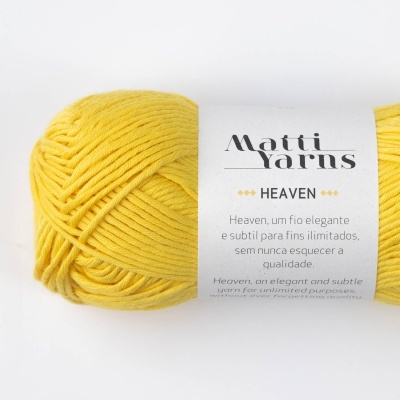 Novelo de fio amarelo com rótulo branco da Matti Yarns e texto HEAVEN
