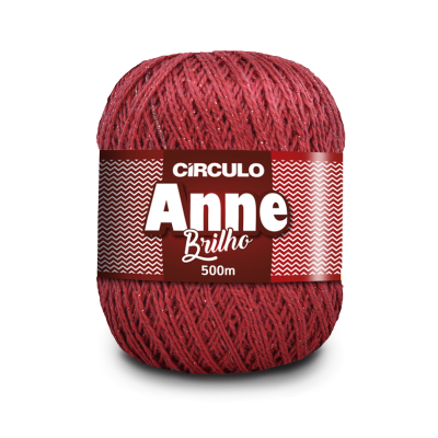 Novelo de lã vermelha com brilho e etiqueta com texto em vermelho e branco