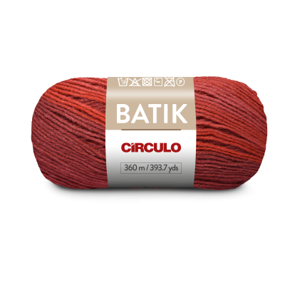 Novelo de fio Batik vermelho e laranja com etiqueta da marca Círculo.