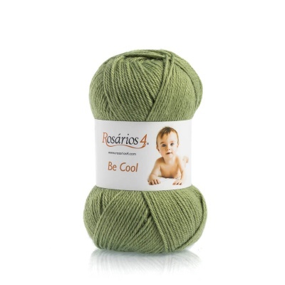 Novelo de lã verde com etiqueta branca e imagem de bebé