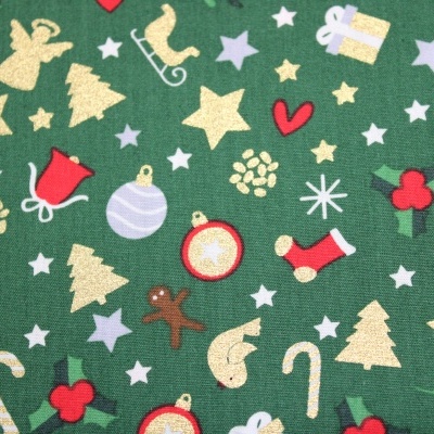 Tecido verde com padrão de símbolos natalícios coloridos