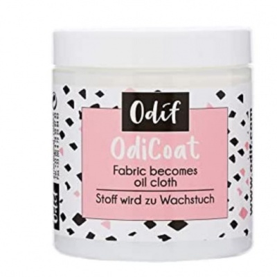 Frasco branco de OdiCoat Odif com rótulo rosa e padrão geométrico