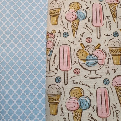 Dois tecidos, um azul claro com padrão branco e outro bege com desenhos de gelados e texto em inglês.