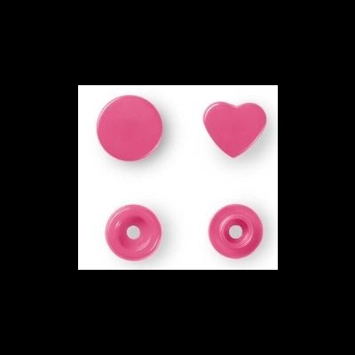 Quatro botões cor-de-rosa, dois sólidos e dois com orifício, fundo branco