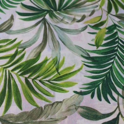 Tecido estampado com folhas tropicais verdes sobre fundo branco