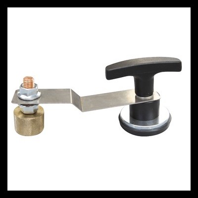 Dispositivo metálico com botão preto e porca dourada