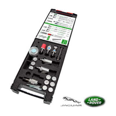 Caixa preta aberta com componentes metálicos e documento, logótipos JAGUAR e LAND ROVER ao fundo