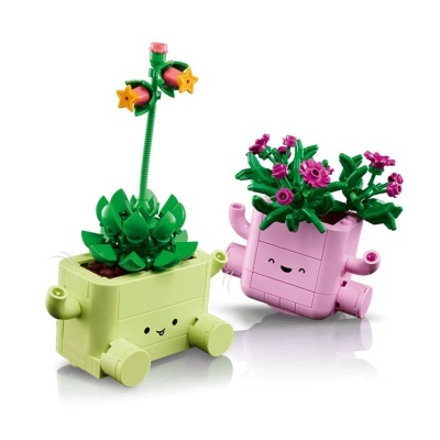 Vasos de plantas LEGO verdes e rosa com flores e carinhas sorridentes