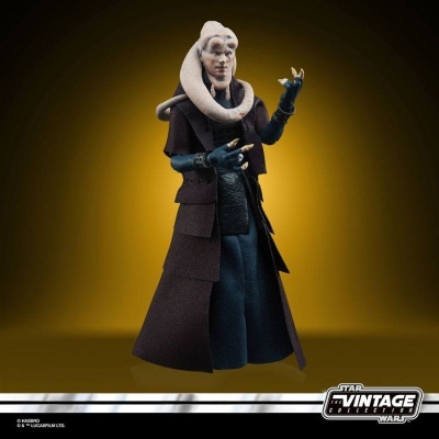 Figura de ação Star Wars Vintage Collection com roupa castanha escura e azul sobre fundo amarelo