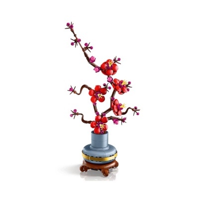 LEGO planta de flores vermelhas e rosa num vaso azul decorativo.