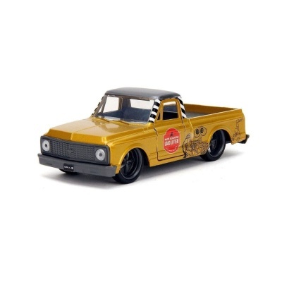 Miniatura de carrinha pick-up dourada com tejadilho preto e adesivo LOAD LIFTER