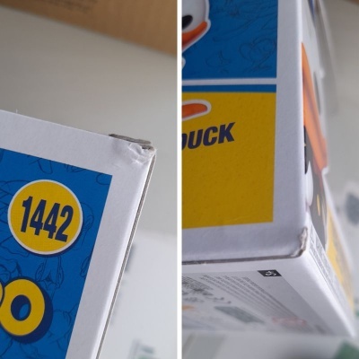 Embalagem azul, amarelo e branca de papelão com número 1442 e cantos danificados