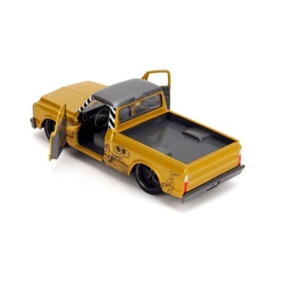Imagem de carrinha de brinquedo amarela com tejadilho cinzento e portas abertas