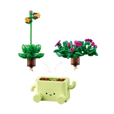 Blocos de construção de plantas com flores e base com carinha sorridente