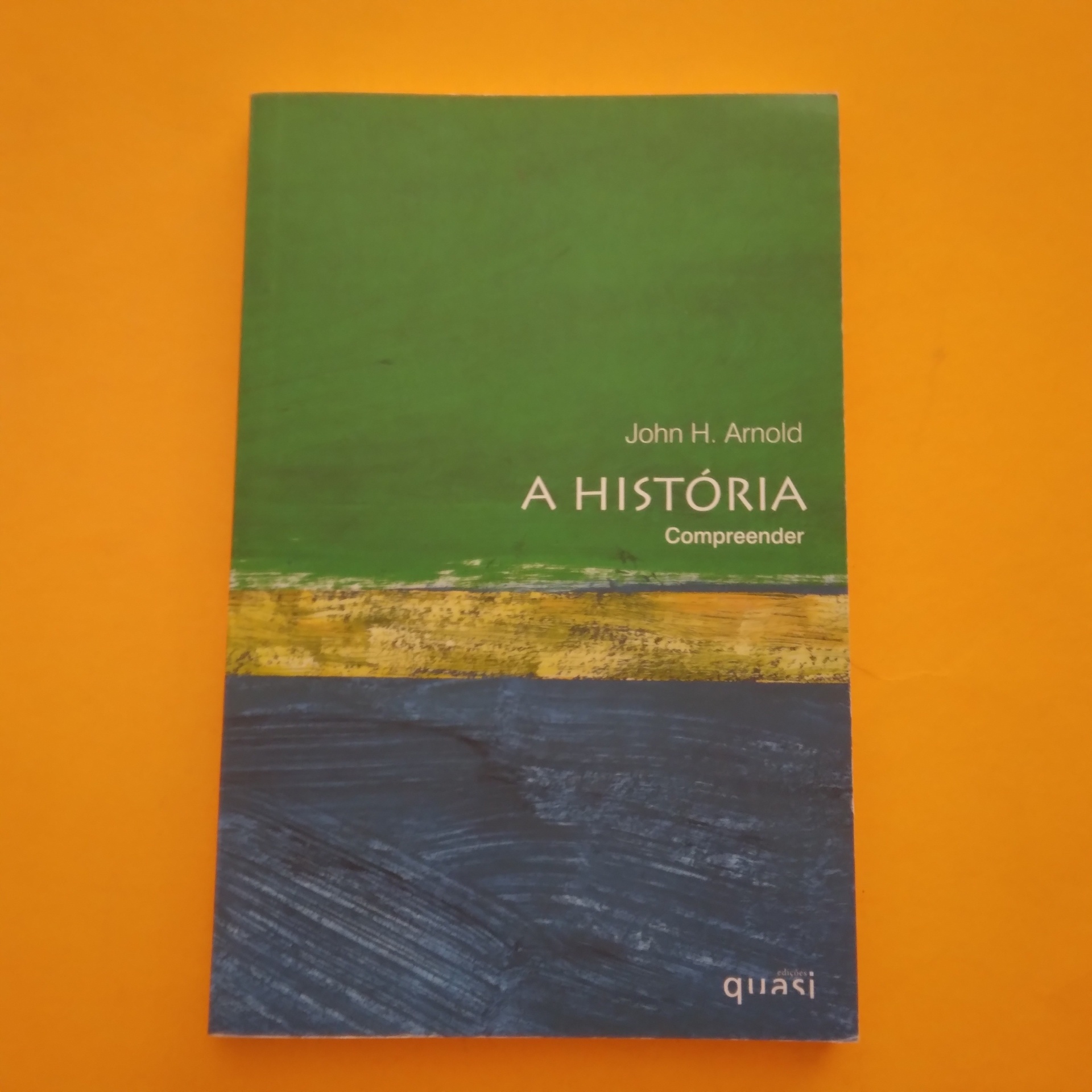 Compreender... A História, John H. Arnold Livro 'A HISTÓRIA Compreender' de John H. Arnold com capa verde, amarelo e azul
