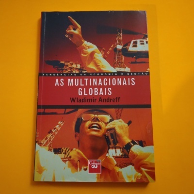 Capa de livro com título e imagens industriais em fundo vermelho e laranja.