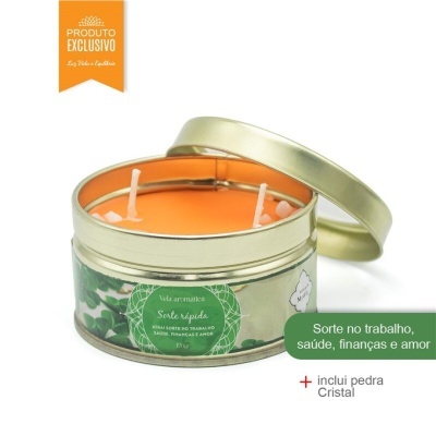Vela aromática em lata metálica dourada com cera laranja e dois pavios