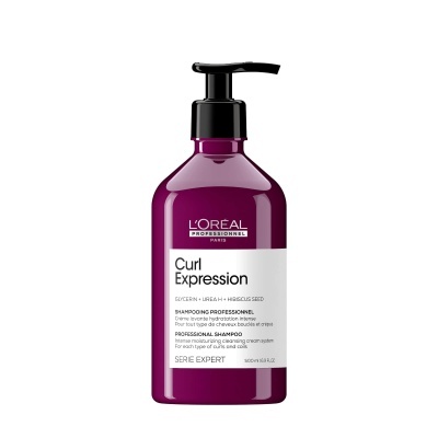 Frasco roxo de shampoo Curl Expression da L'Oréal com tampa de bomba preta e rótulo branco