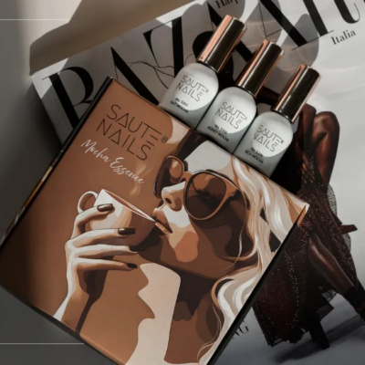 Frascos de verniz de unhas com caixa ilustrada e revista BAZAAR Italia