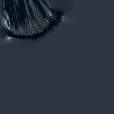 Superfície cinza escuro com textura e cerdas pretas visíveis no canto superior esquerdo