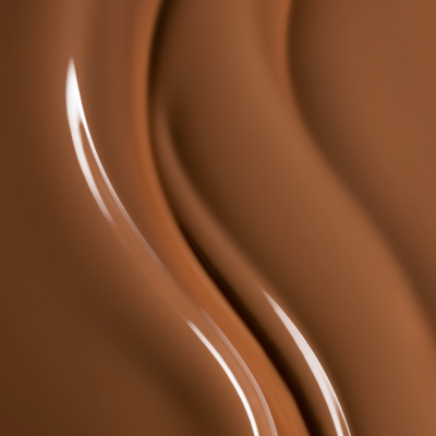 Superfície cremosa de chocolate castanho com brilho e ondas suaves