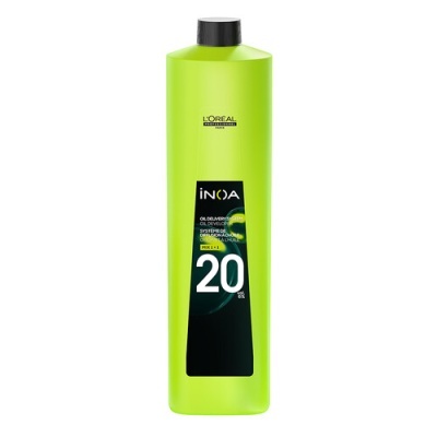 Frasco verde lima de L'Oréal INOA com tampa preta e rótulo preto com texto branco e verde