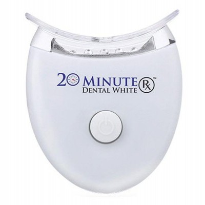 Dispositivo branco para branqueamento dentário com texto e botão frontal.