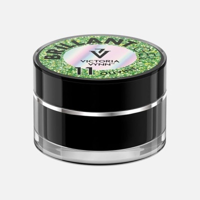 Frasco preto pequeno com tampa decorada e texto 'BACKSTAGE GLOW VICTORIA LYNN 11'