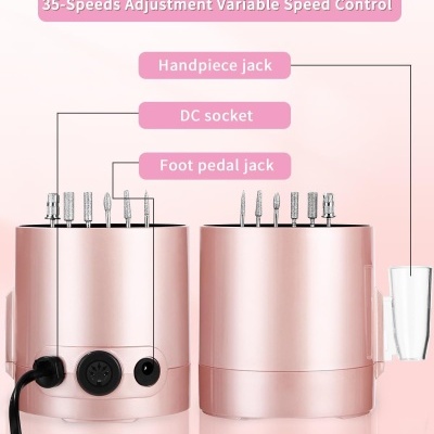 Aparelho rosa metálico com vários pinos e etiquetas de conexões e velocidades