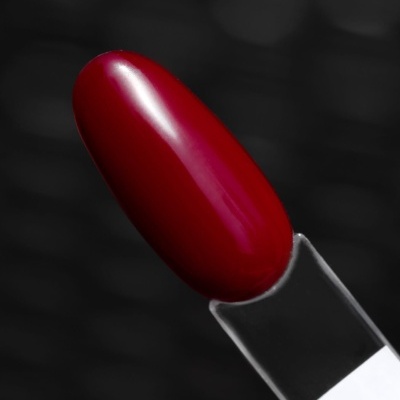 Unha artificial vermelha brilhante para teste de esmalte