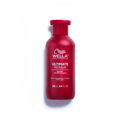 Frasco vermelho de shampoo Wella Ultimate Repair com texto branco