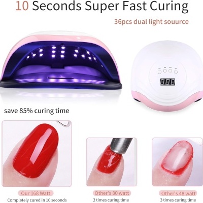 Cabine de cura para unhas LED rosa e branca com luzes acesas e exemplos de unhas vermelhas curadas
