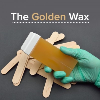 Frasco de cera dourada para depilação com luva verde