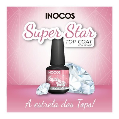 Frasco de verniz de unhas Inocos Super Star Top Coat com dois diamantes artificiais em fundo rosa.