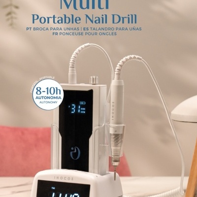 Broca portátil para unhas INOCOS com base carregadora branca e visor digital azul.