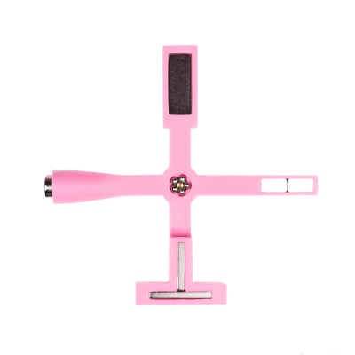 Ferramenta rosa para manicure com suporte em cruz e diferentes áreas funcionais