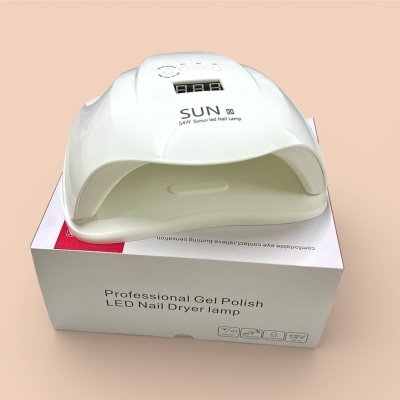 Lâmpada branca para unhas LED com visor digital sobre caixa branca