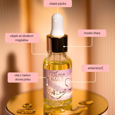 Frasco de óleo com conta-gotas e etiqueta rosa com texto em polaco sobre superfície dourada espelhada