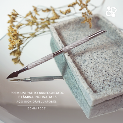 Palito para manicure em aço inoxidável japonês com lâmina inclinada na base de pedra cinza
