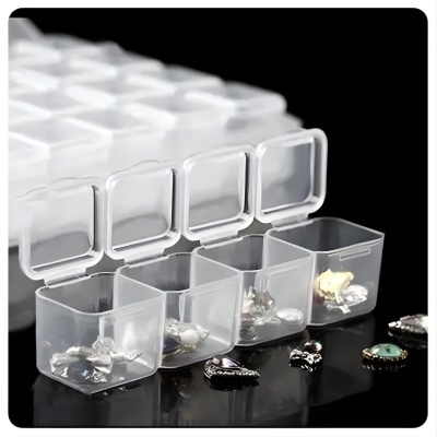 Caixa organizadora transparente com compartimentos quadrados e joias pequenas