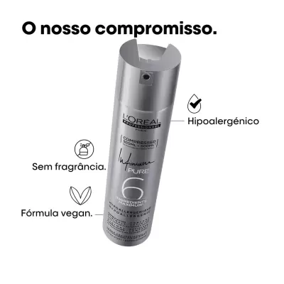 Frasco de spray prateado L'Oréal Paris com texto sobre compromisso do produto
