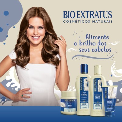 Produtos Bio Extratus para cabelo com mulher sorridente e texto promocional.