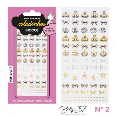 Autocolantes para unhas com desenhos de coroas, estrelas e laços em dourado e prateado.