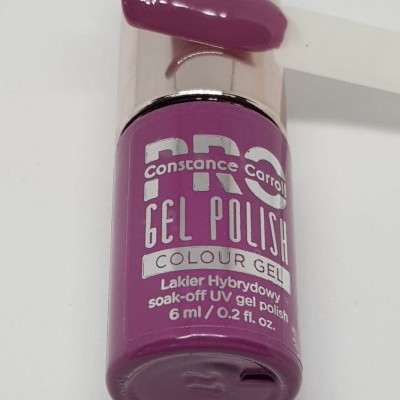 Frasco de verniz gel roxo com tampa prateada e amostra do verniz