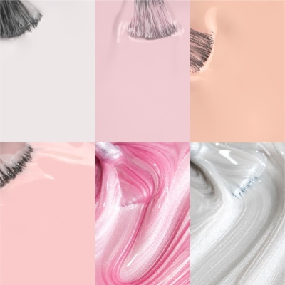 Close-up de pincéis aplicando maquilhagem em tons pastel e metálicos