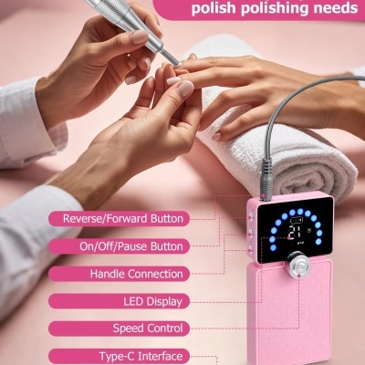 Dispositivo elétrico rosa para manicure com LED e botões, uso em unhas sobre toalha branca.
